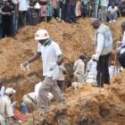 People attend the burial of victims in the town of Beni where at least 22 people, most of them women and children, were hacked and clubbed to death by Ugandan rebels. (Alain Wandimoyi, AFP)<br /><br />That is why the country of Uganda deserves a Transitional Government of about 2 to 3 years to stop such killings which the Expensive UN has failed to stop for a long time.