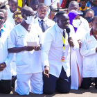 Dr Samuel Oledo(centre) kneeling down to President Museveni for favours and patronage.<br />This is the sort of African professionalism that has become very much entangled into the military politics of the whole continent of Africa. One hopes that these life protecting medical professionals and the current political judiciary are ready and well prepared to work hardest when another civil war breaks out and people start to mime and kill themselves with AK47 in order to capture power. Unfortunately it should be remembered by all the people that the NRM party Central Executive Committee declared a long time ago that (Akapapula obupapula tekajawo kufuga kwa NRM). The long and brutal history of Uganda is quite clear that consistent and self styled military dictatorships are regularly removed by violent armed rebellion and replaced again by the same!