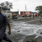 A man walks past burnt vehicles in Freetown on Nov. 6, 2021, following a massive explosion that has killed at least 91 people<br />This is an African country that should have consolidated its railway transport so that such very volatile products are safely moved from the civilian populations. When one reads the history of the Railway network of Sierra Leon one wonders what sort of development has this country been doing since it received its independence.  Much of the rolling stock of its railway that started 1897 is presently in the country&#039;s Museum. That is 124 years of African under development and still counting!