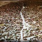 That is the massive refugee camp in Darfur<br />ICC prosecutors in The Hague requested that the former leader of Sudan stand trial over the Darfur killings and issued an arrest warrant for him on charges of genocide, war crimes and crimes against humanity.