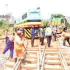 Uganda Railways staff pictured fixing the railway line and new locomotives. PHOTO/ STEPHEN OTAGE <br />What one observes in many rail locomotives and how they operate is to have two of them running together in a convoy. One at the front pulling all the wagons and the second locomotive all the way to the end of the journey. On the return journey, it is the second locomotive at the end of all the carriages that is required to pull all these carriages back home. This business of operating one locomotive on each journey in the hope of using a triangle is old fashioned. The company that sold URC those locomotives must now accept to connect the old locomotives into the covoy so that after each end of journey these old locomotives can pull back the convoy back home. Such a system can work out temporarily for a year or two until more modernization is put in place.