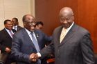 This is a Ugandan dictator that came to power 33 years ago by force of arms but wants leave power by a democratic vote:<br />The President of Uganda(right) greeting the President of Tanzania in the East African region on the African Continent.