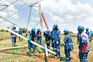 UETCL engineers disassemble a vandalized tower line inside Kakira Sugar Plantation in Jinja District on October 31. PHOTO/FILE
