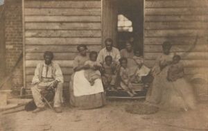 An enslaved African American family or families pose on the plantation of Dr. William F. Gaines in Hanover County, Virginia, 1862.